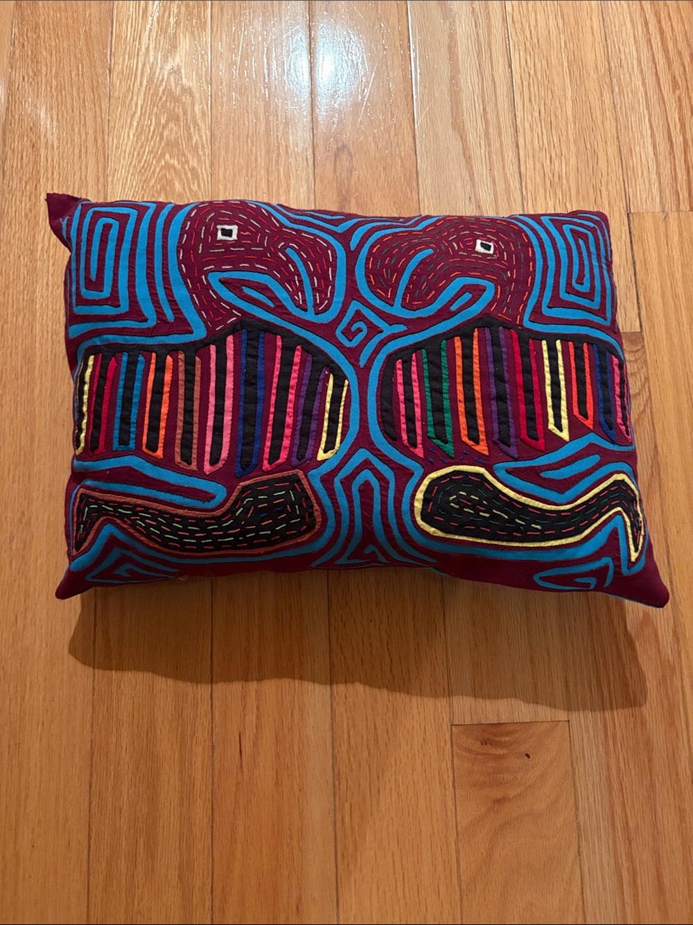 Embroidered Maroon Accent Pillow with Turquoise and Multicolor Stitching